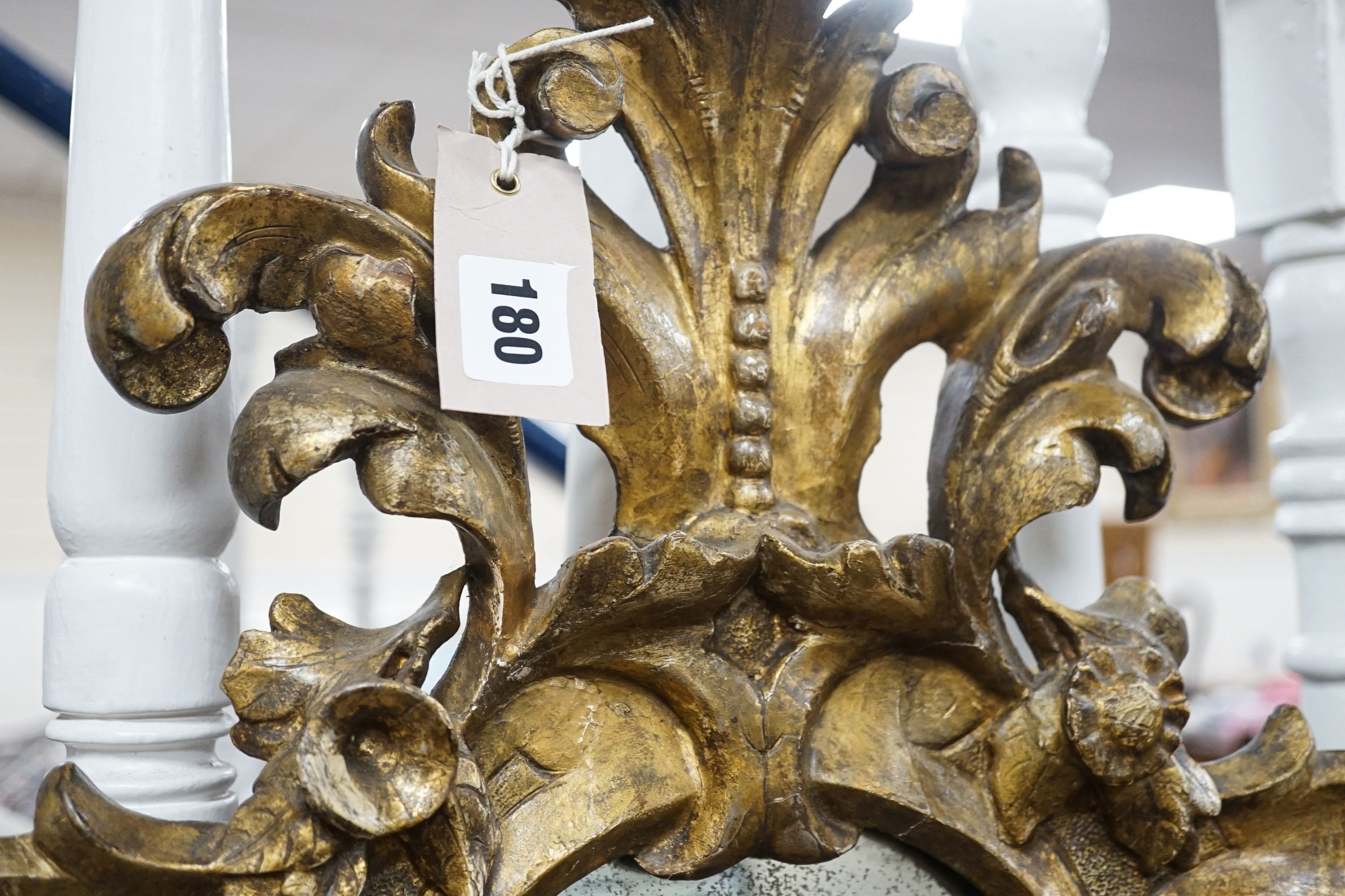 An 18th century Italian carved giltwood cartouche wall mirror, width 53cm, height 76cm